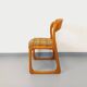 Vintage sled chair by Baumann in wood and wool fabric.