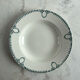 Set of 3 St Amand deep plates with green crown decoration.