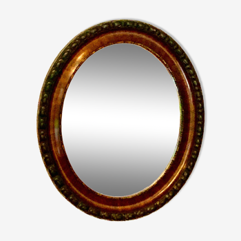 Oval beveled rosewood mirror
