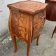 Pair of bedside tables with bombé shape, marquetry, and bronze in Louis XV style.