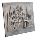 Plaque en fonte signée
