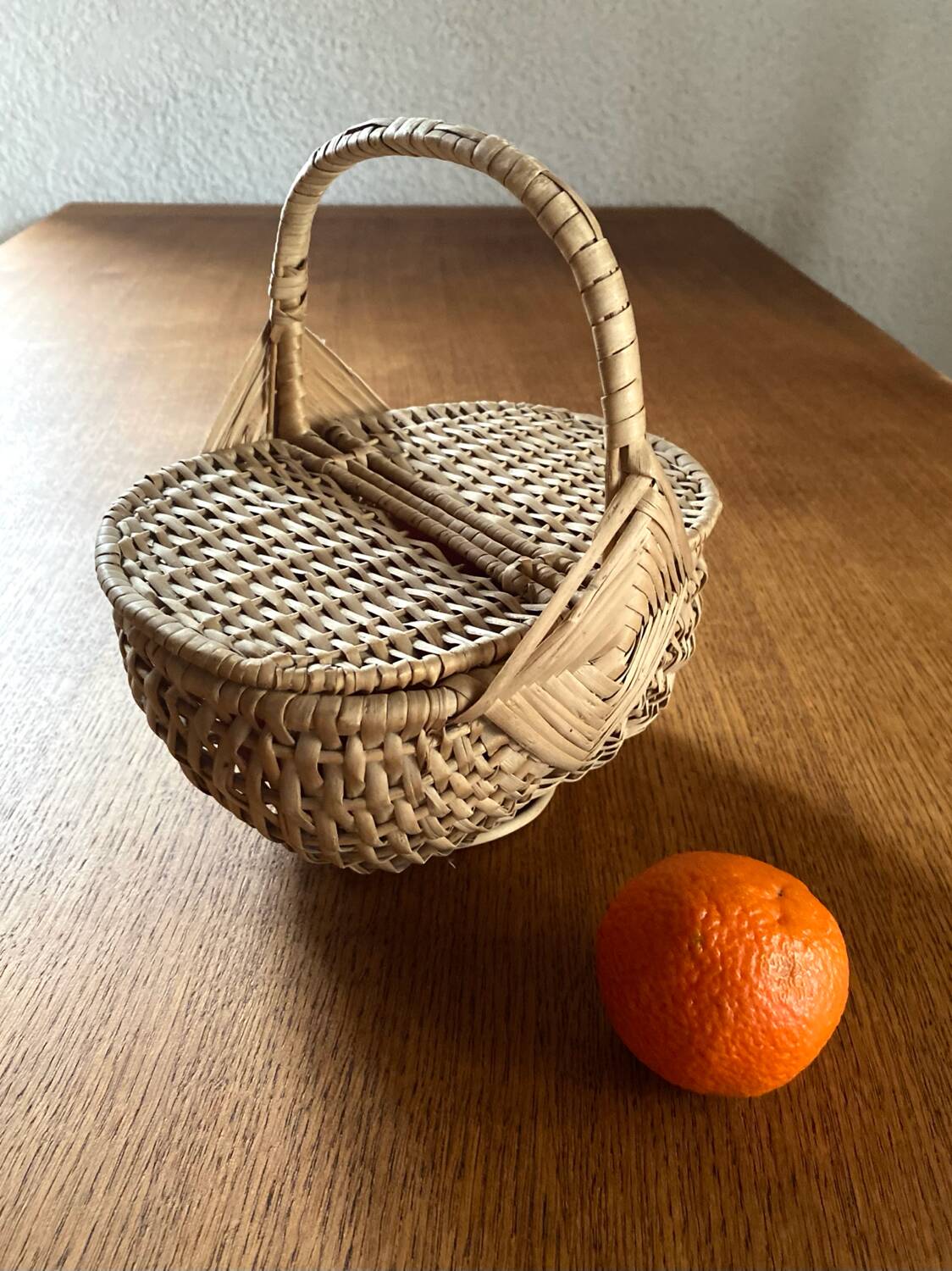 Handcrafted egg basket made of woven rattan and wicker