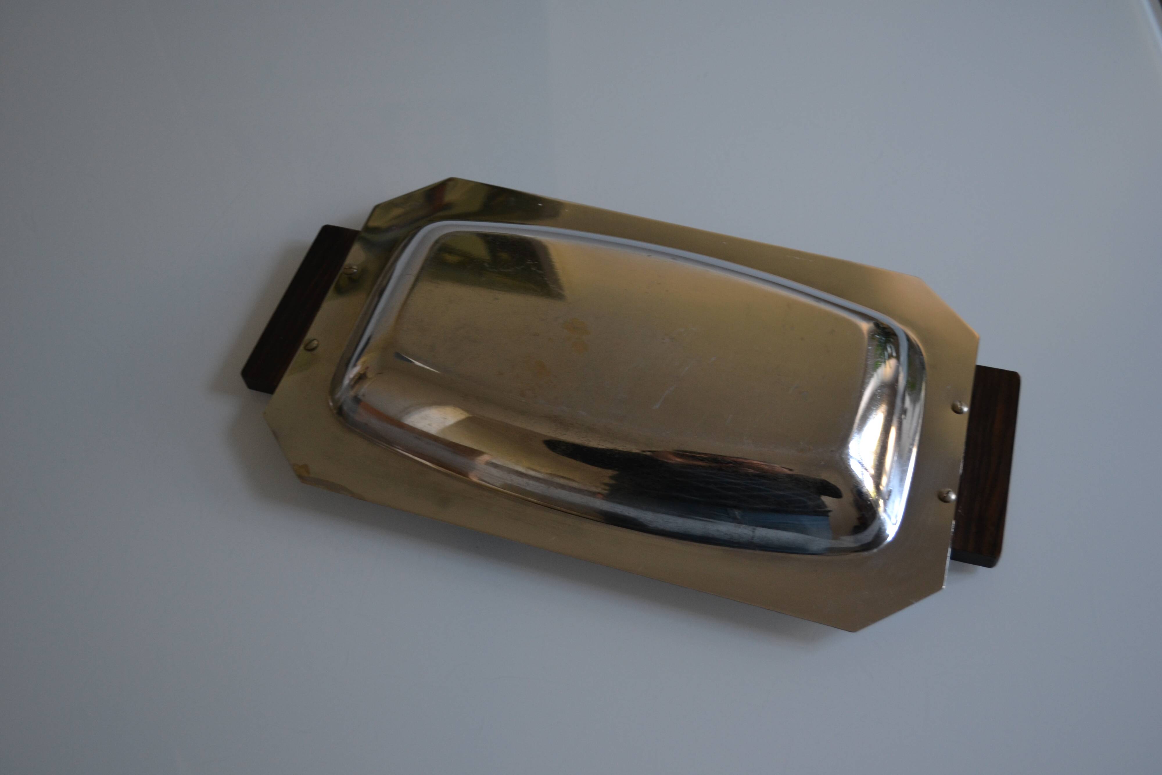 Art Deco serving dish in chrome metal with ebony handles.