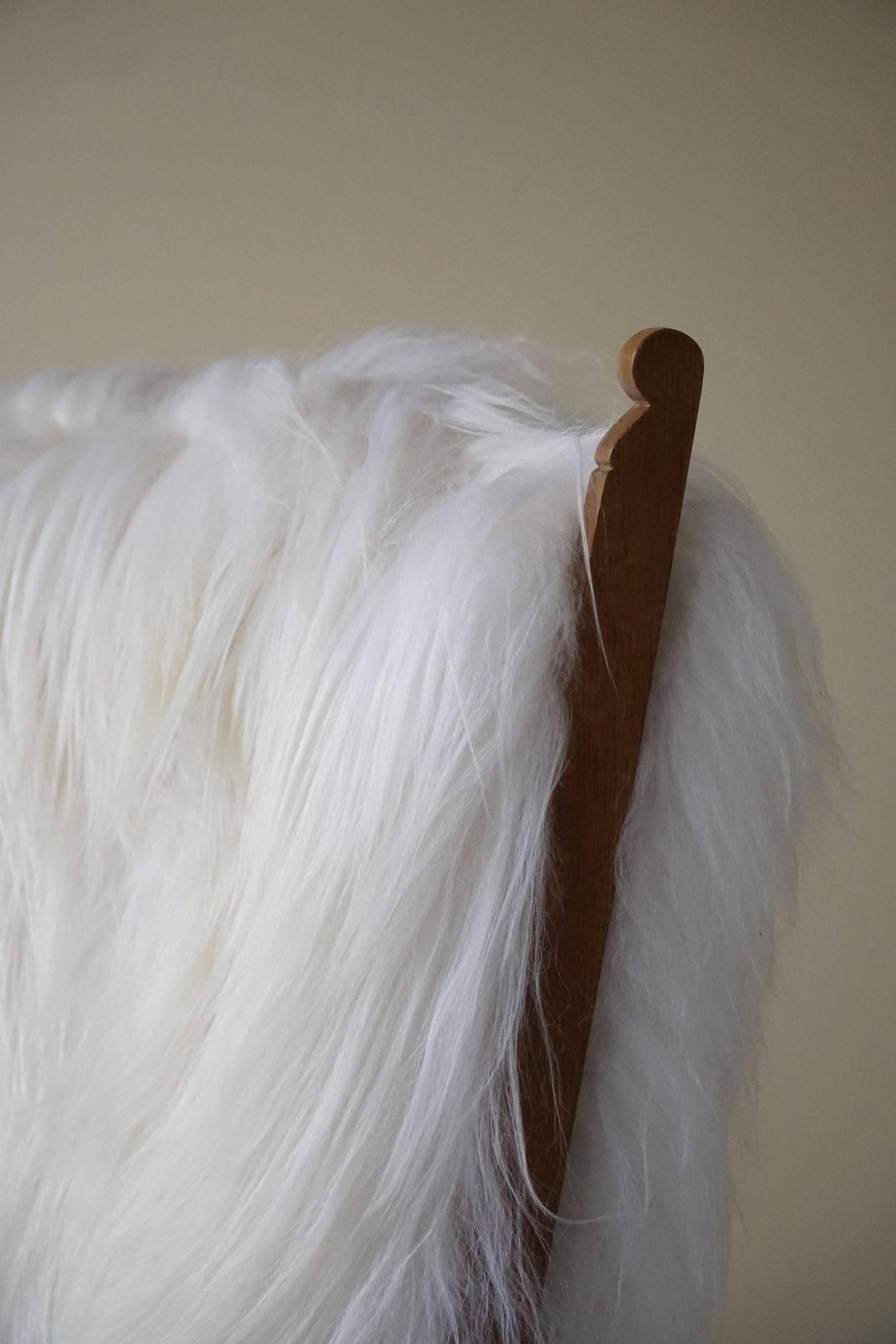 Henning Kjærnulf, armchair reupholstered in long-haired Icelandic sheepskin, 1950