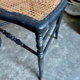 Napoleon III chair in black and gold wood with caning.