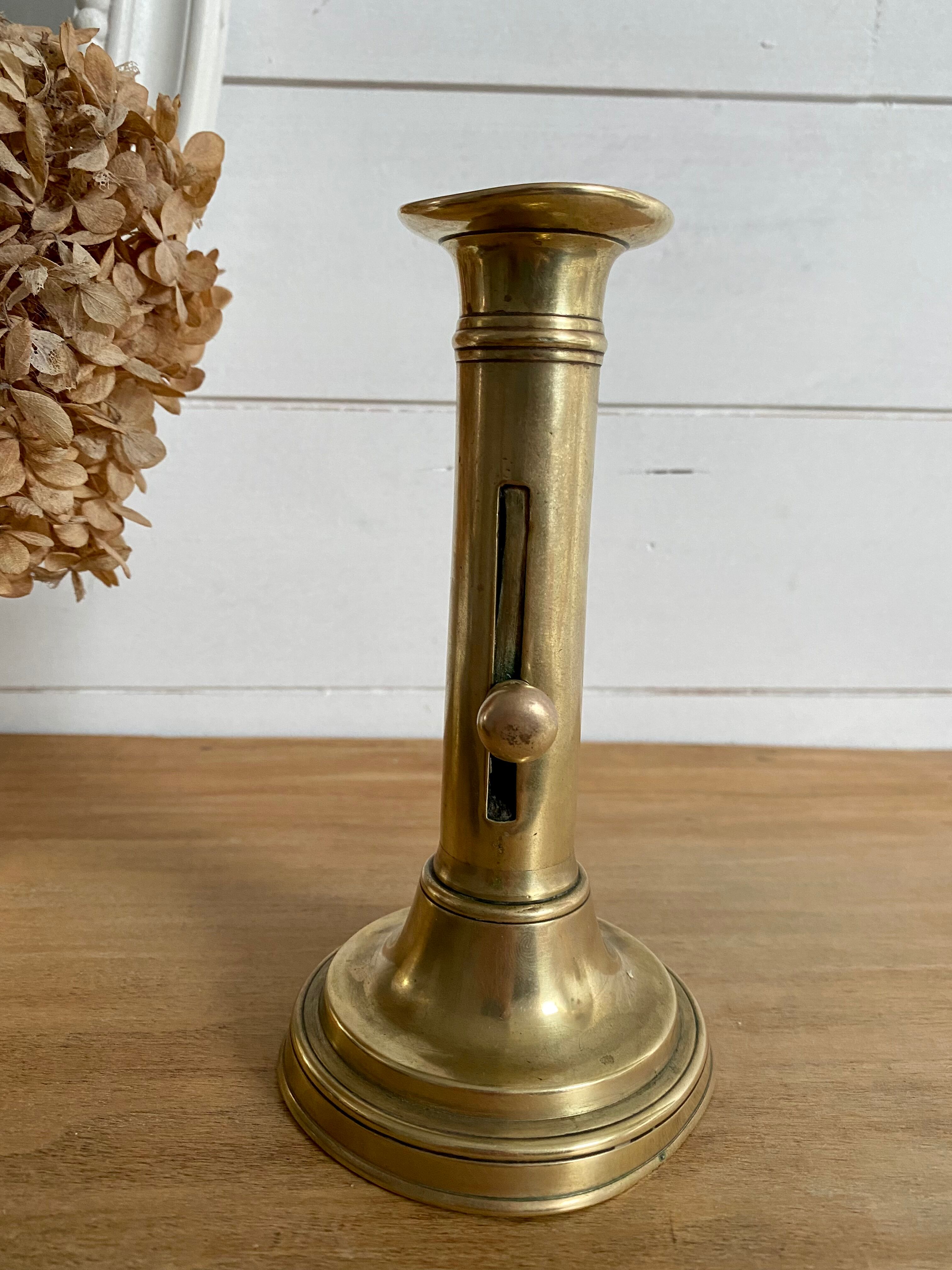 Nineteenth-century brass pull-out candle holder
