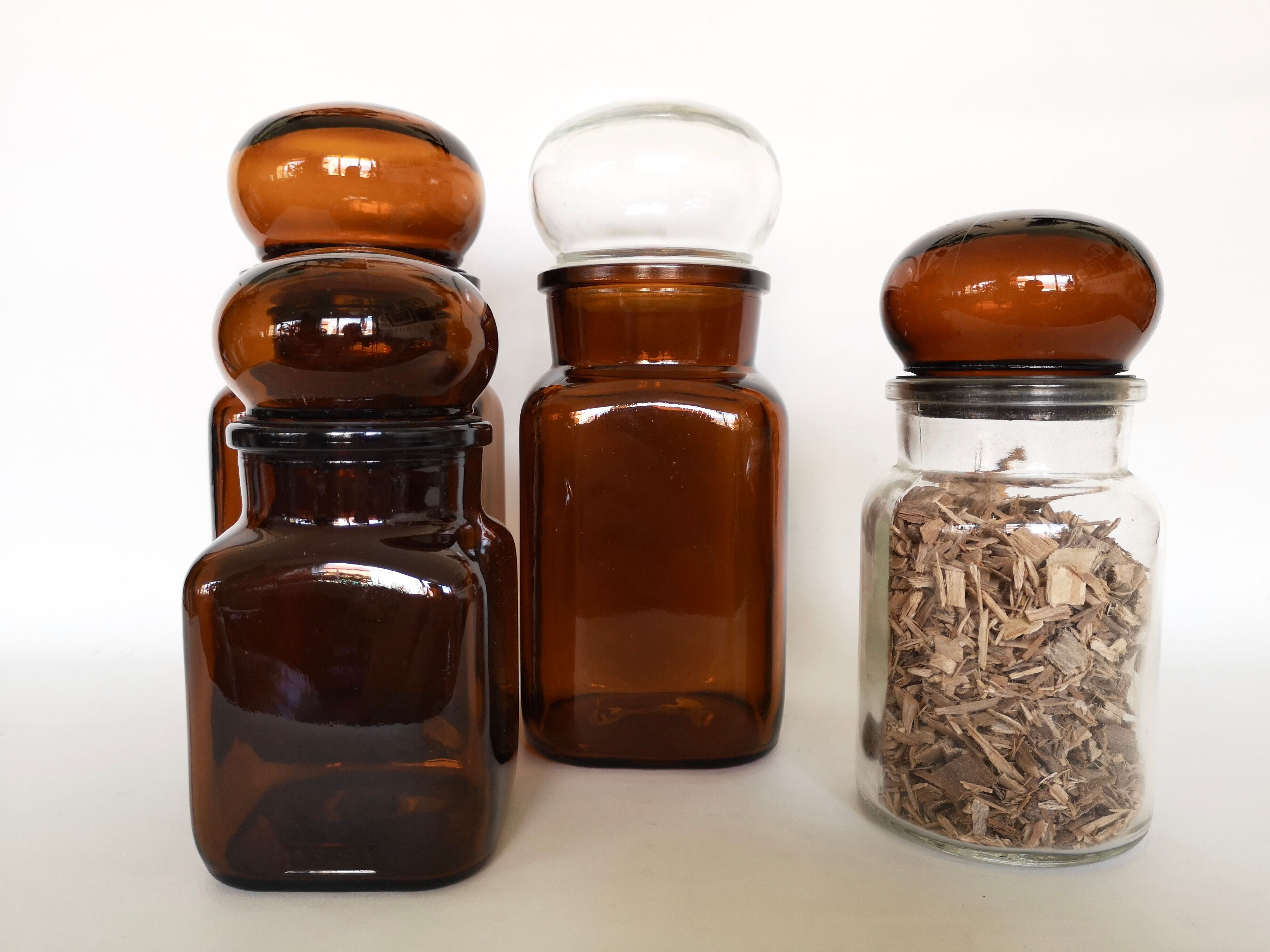 Set of 4 clear and brown glass jars