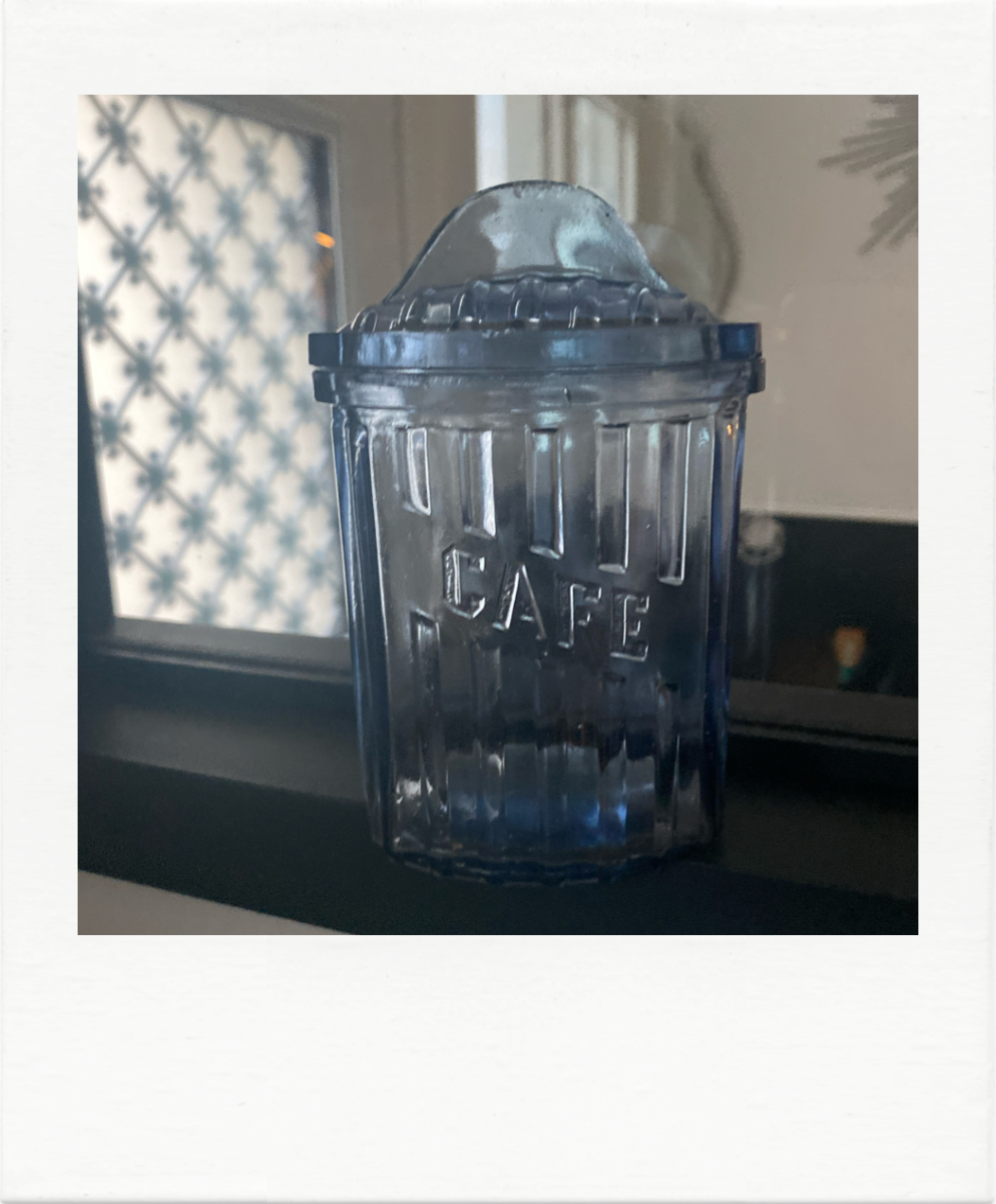 Old coffee pot in blue glass