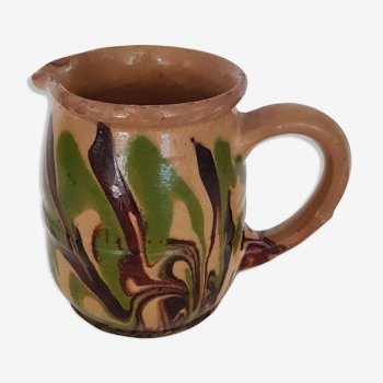 Pitcher in mixed brown, ochre and green