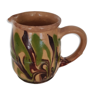 Pitcher in mixed brown, ochre and green