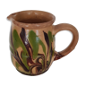 Pitcher in mixed brown, ochre and green