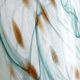 Blown glass vase marbled in white, water green, and with golden inclusions –