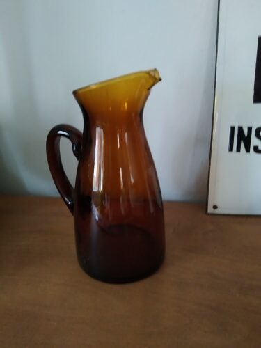 Vintage pitcher in amber glass