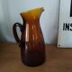 Vintage pitcher in amber glass