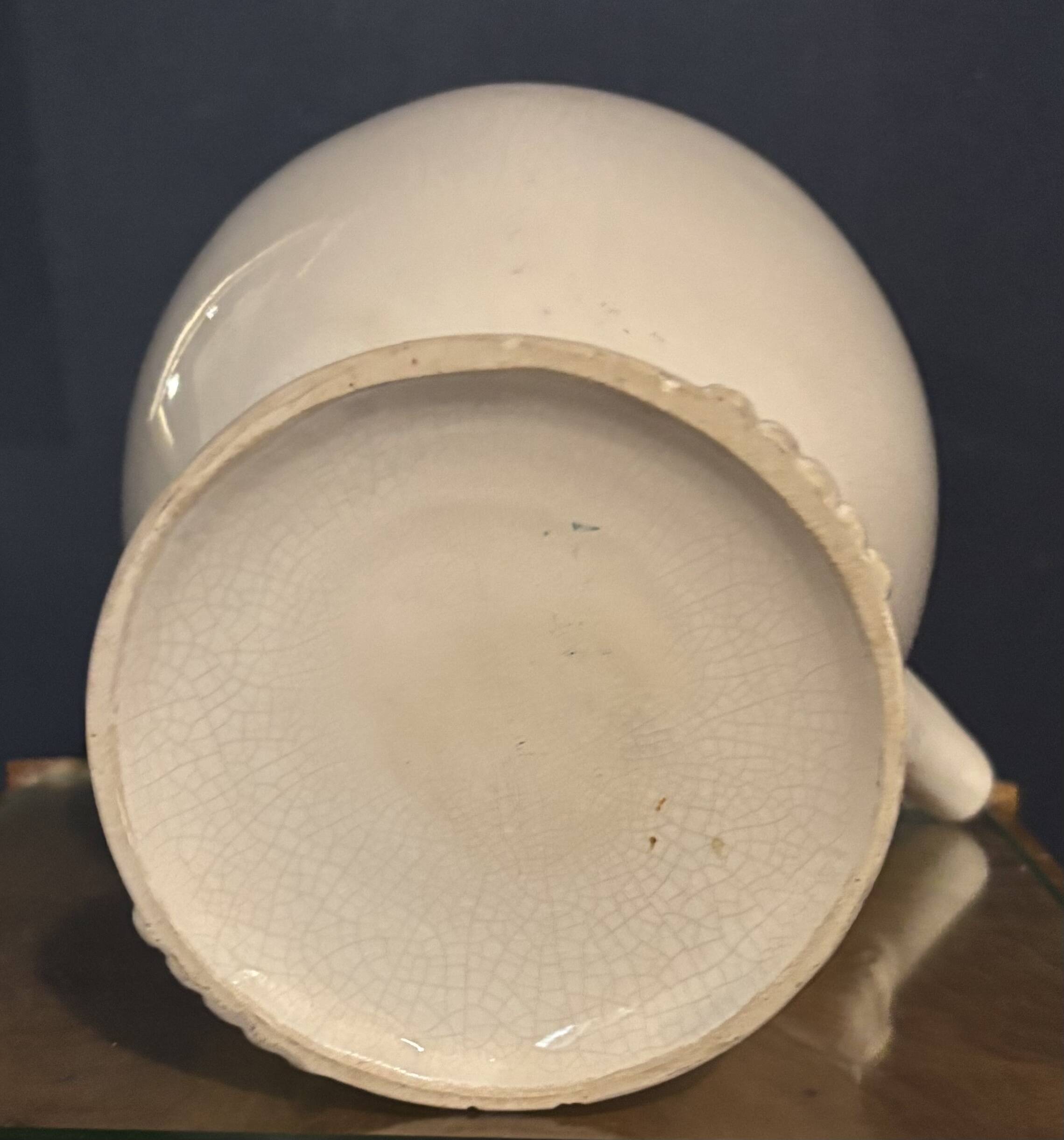 Large white faience jug with a satyr head spout, 19th century.