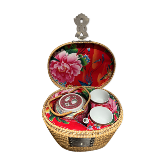 Chinese porcelain tea set in its portable wicker basket