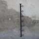 Wall-mounted wrought iron coat racks.