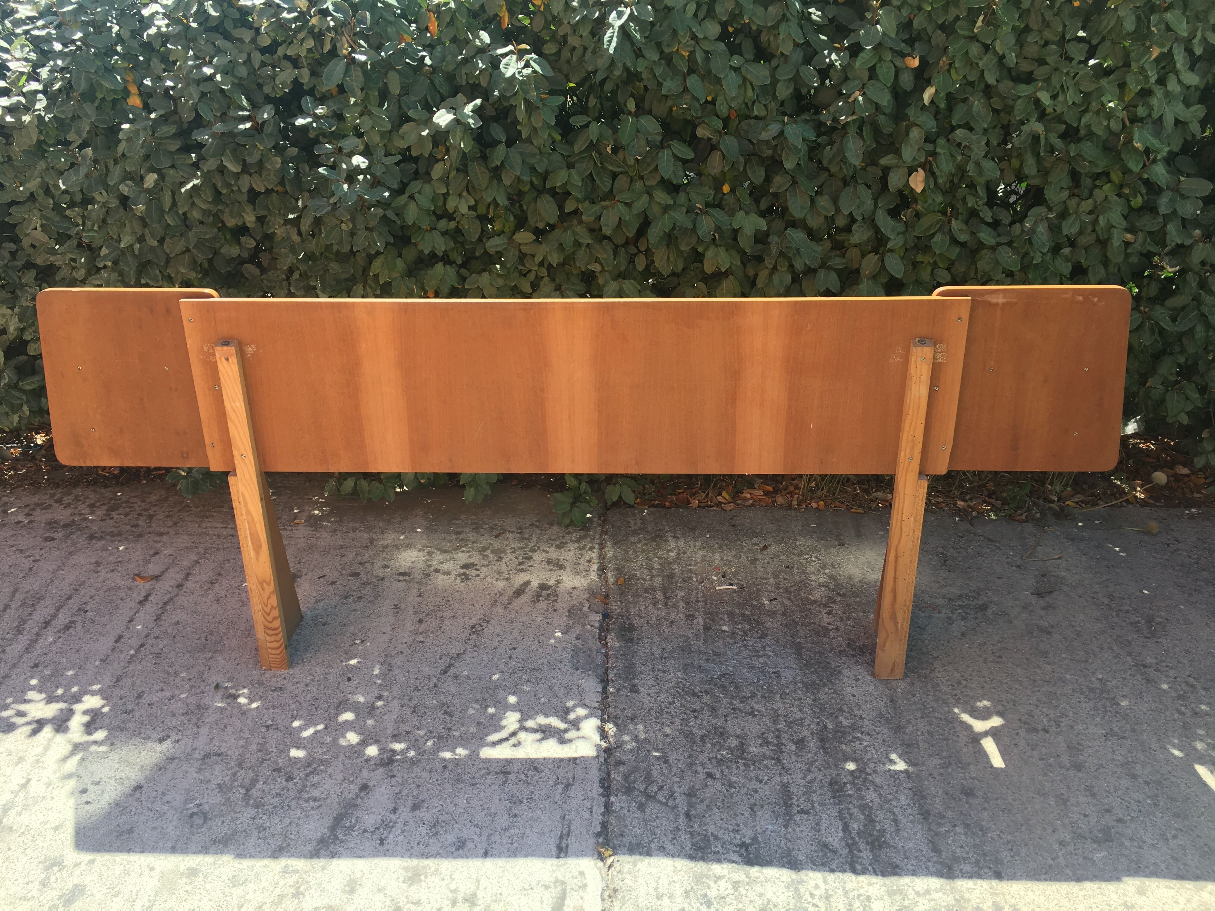 Vintage headboard with hanging bedside tables
