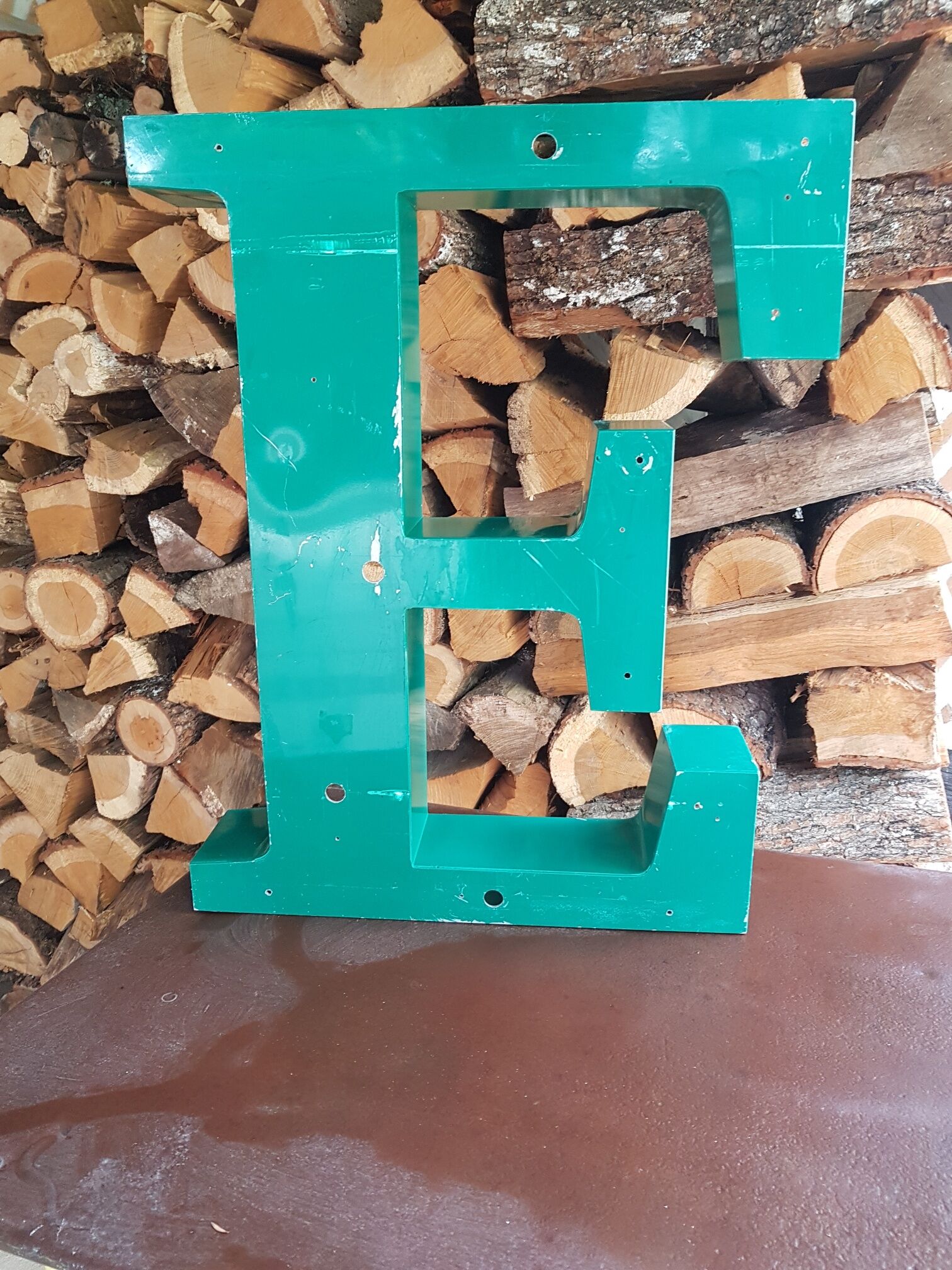 Large sign letter "E" metal