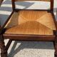 Armchair in stained oak and straw, French work from 1950.