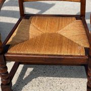 Fauteuil en  chêne teinté et paille, travail français 1950