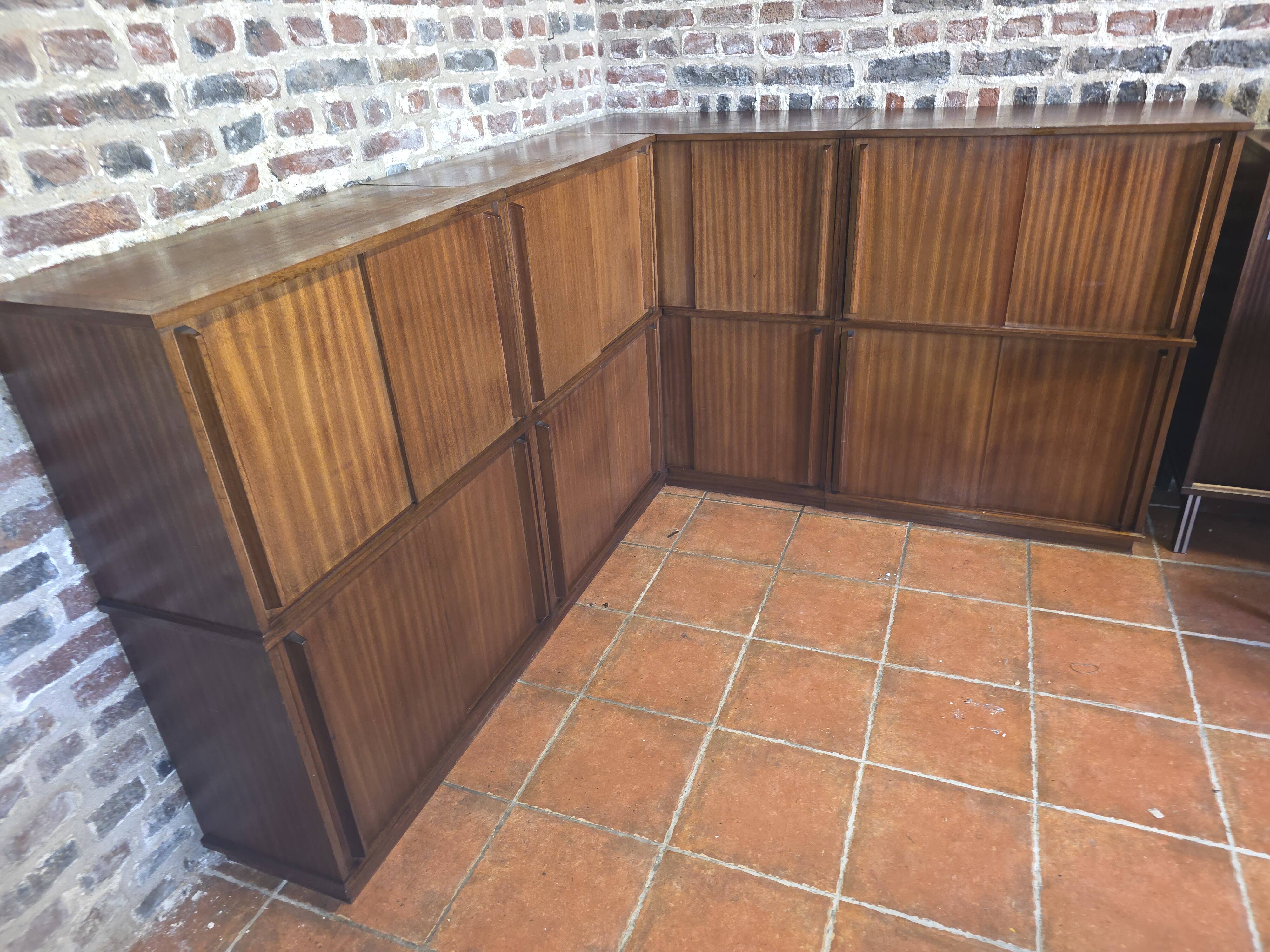 Modular corner library Oscar from the 1960s with sliding doors.