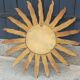 Miroir soleil en bois et stuc doré, années 50