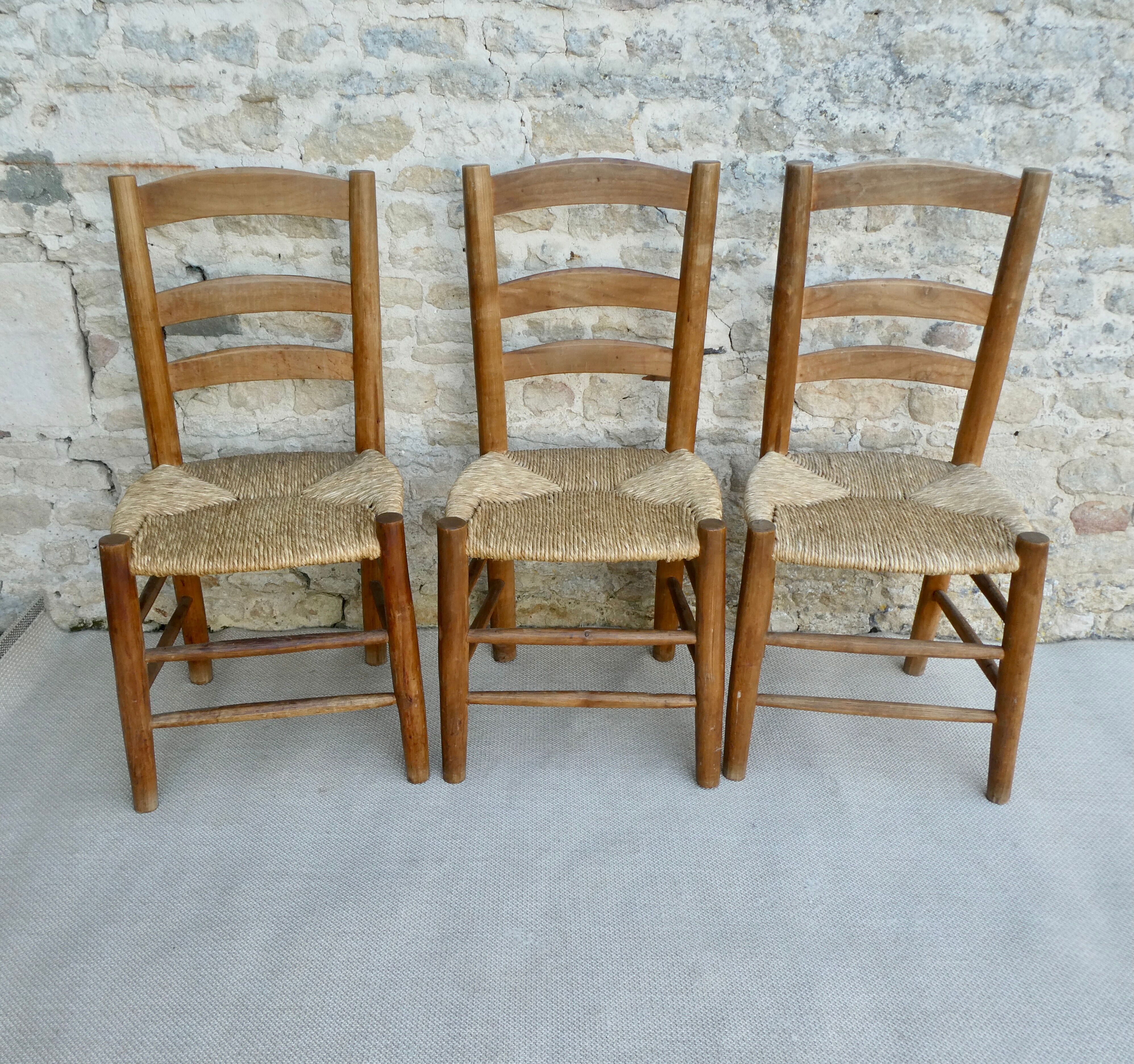 Trio of wooden chairs and mulched seat