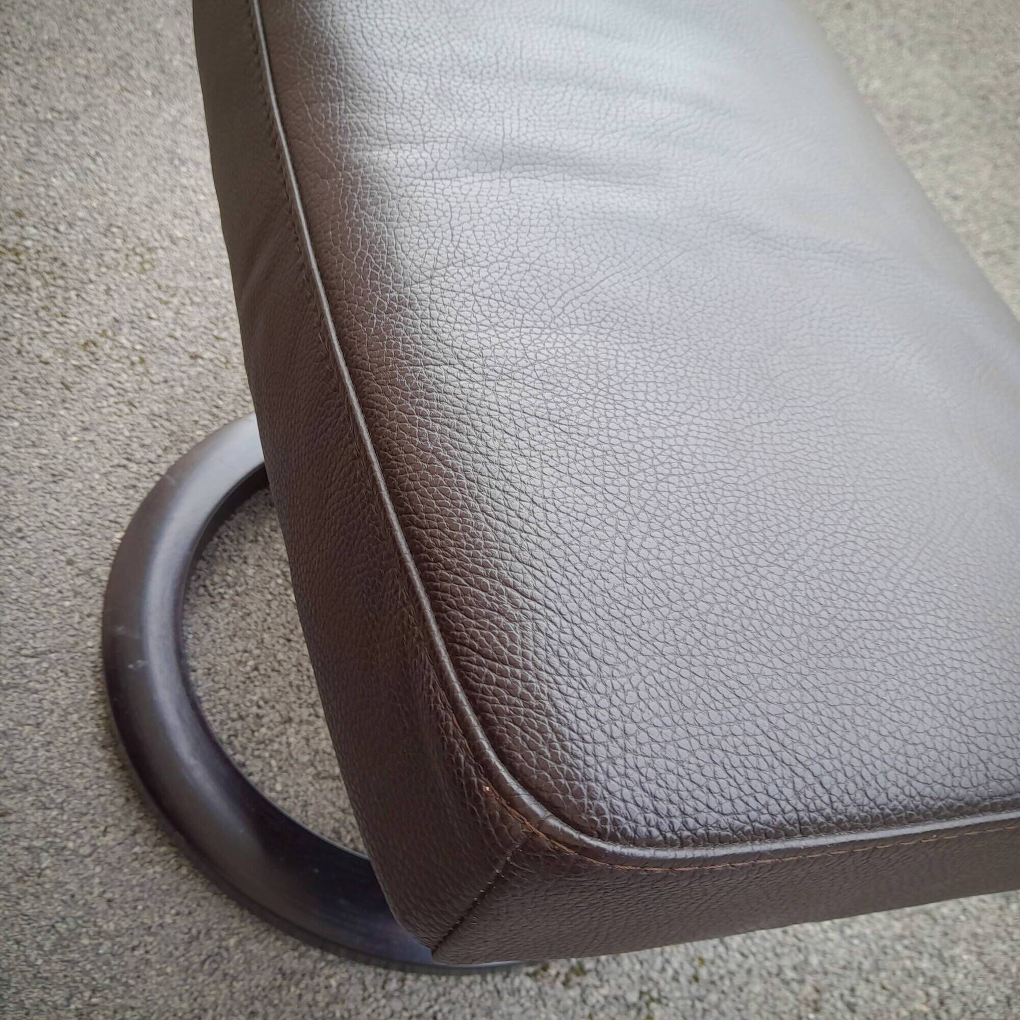 Pair of Scandinavian leather armchairs and ottoman, Ekornes, Norway, 1970
