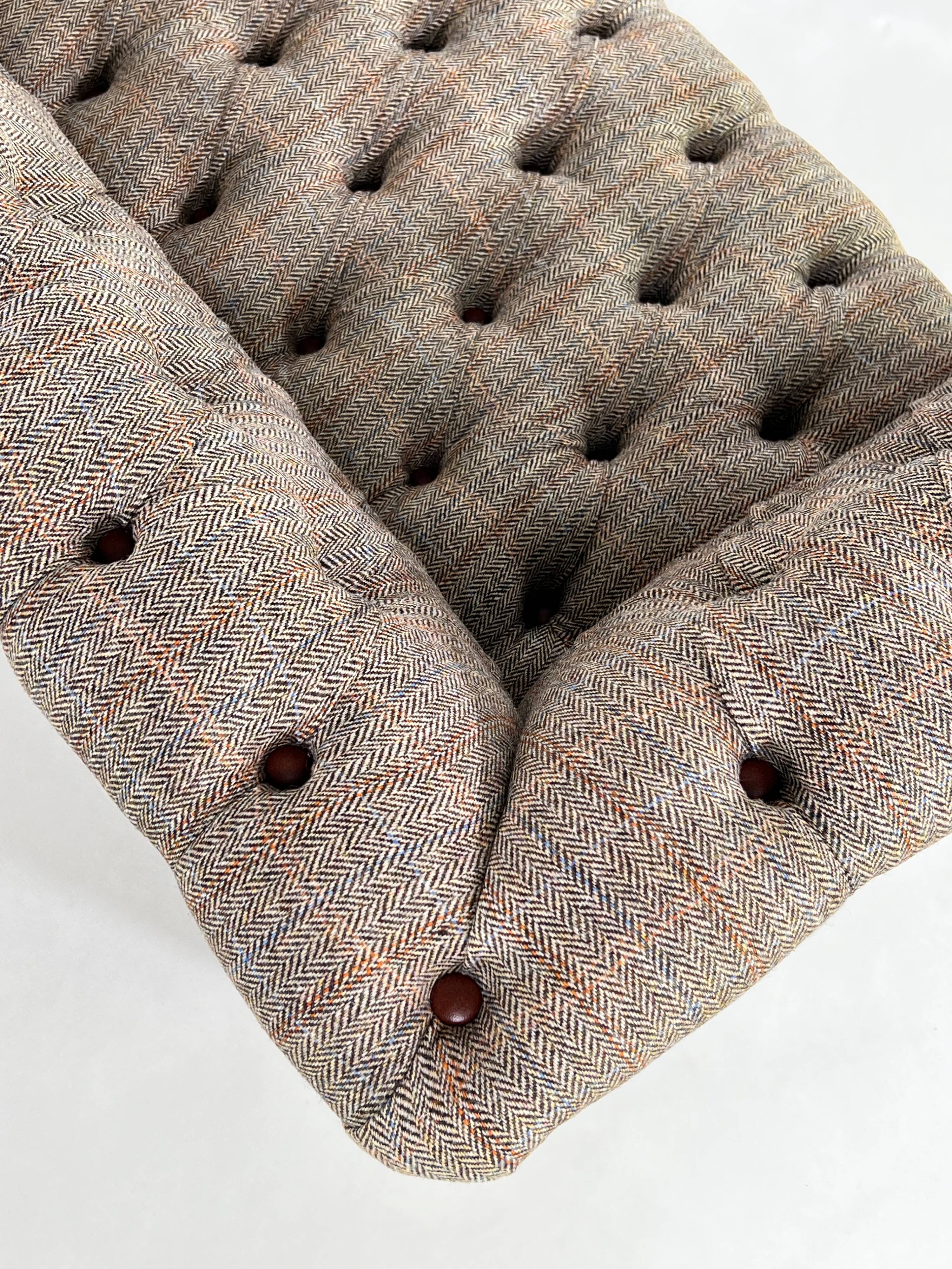 Chesterfield sofa in leather, fabric and wood