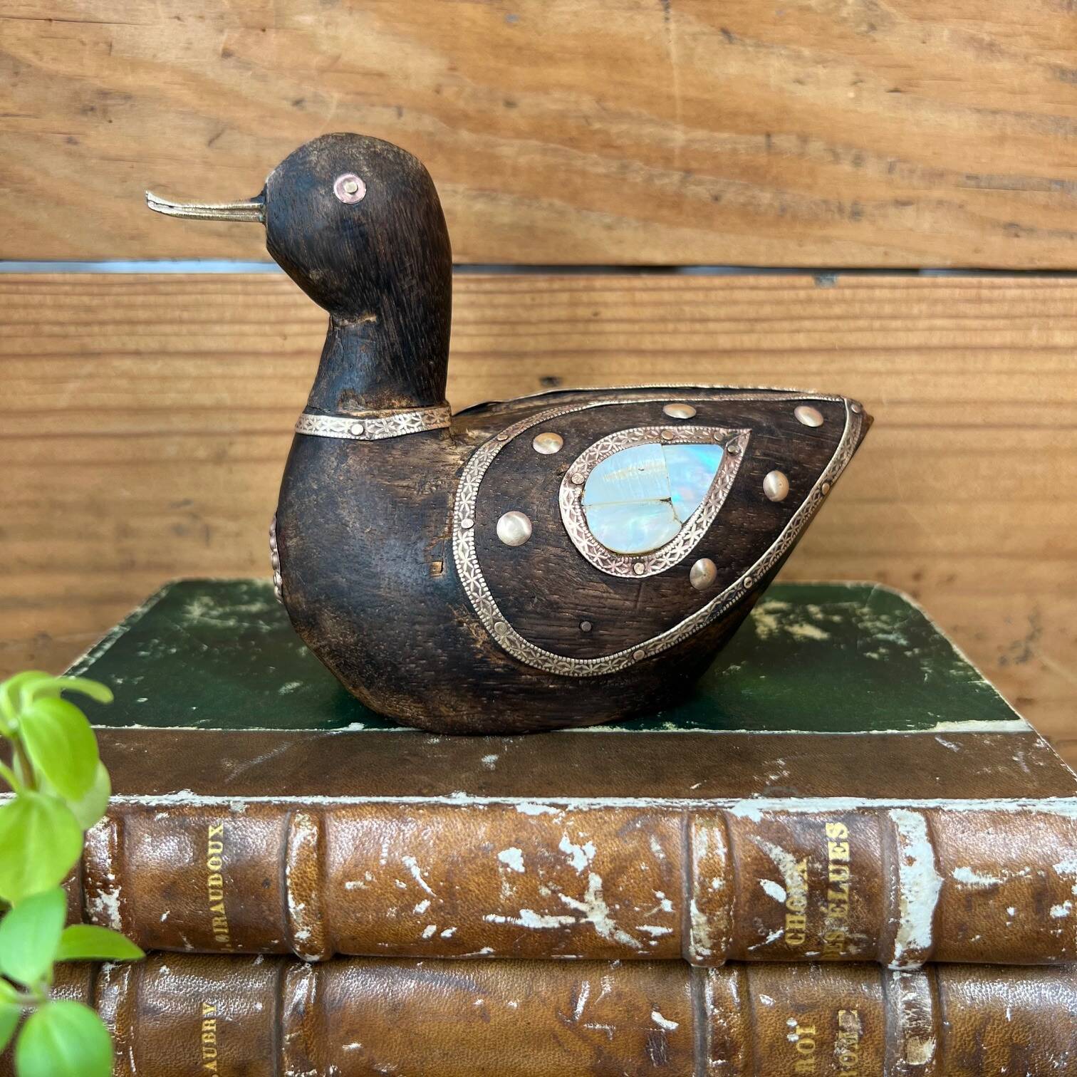 Bird in dark wood, brass & mother-of-pearl