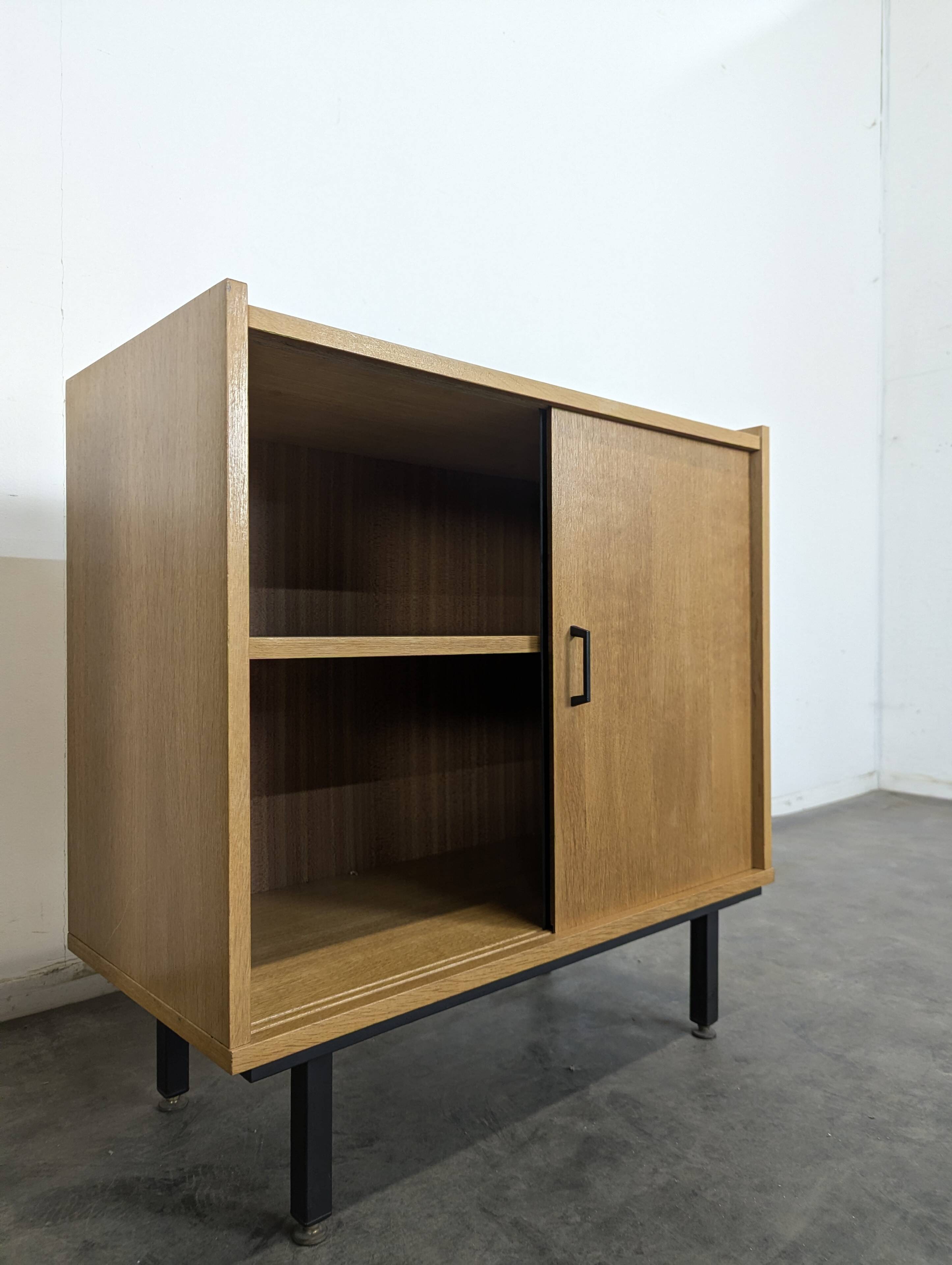 Pair of modernist sideboards with black glass doors in oak veneer.