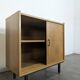 Pair of modernist sideboards with black glass doors in oak veneer.