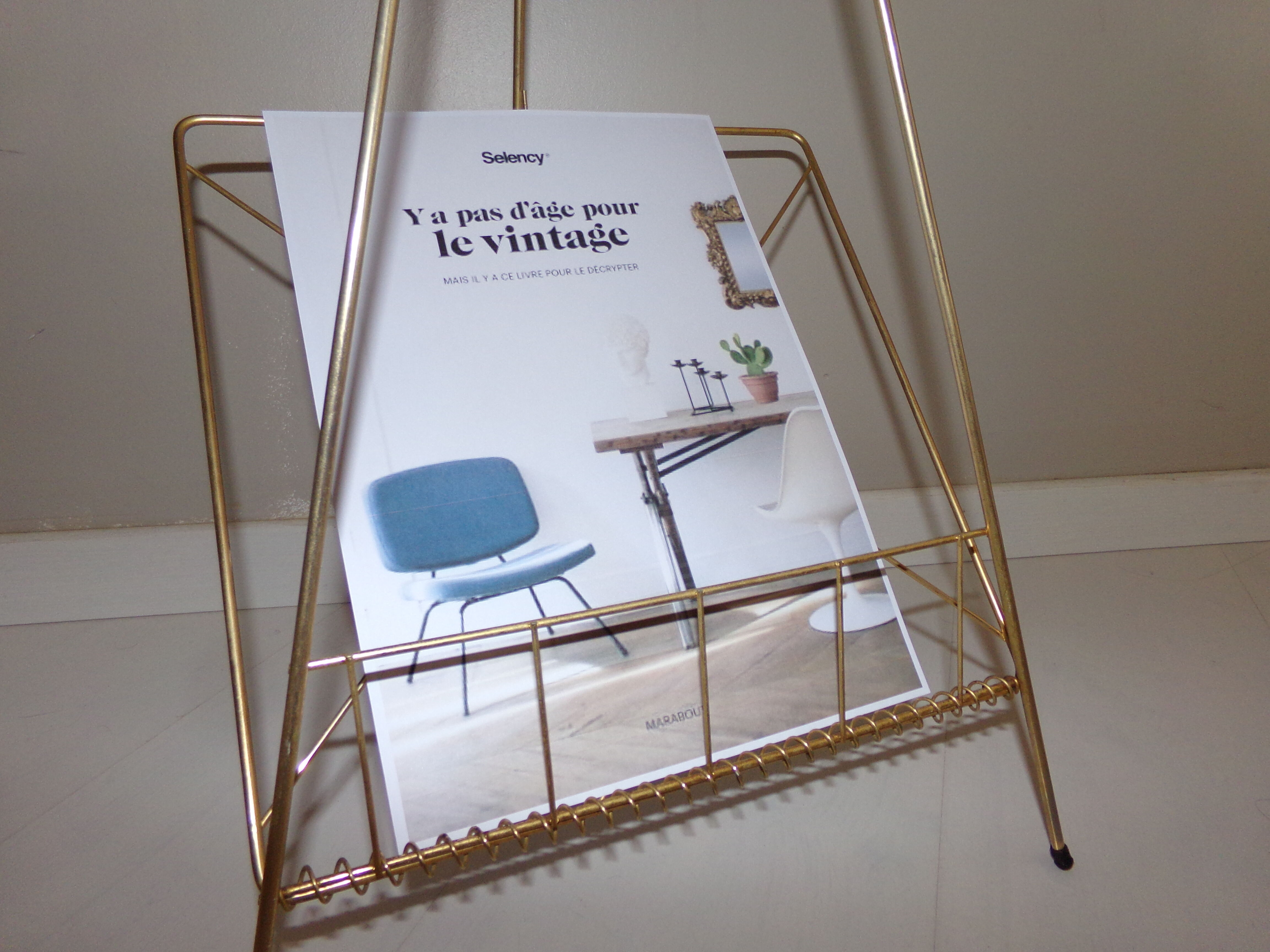 Vintage magazine holder in gold metal