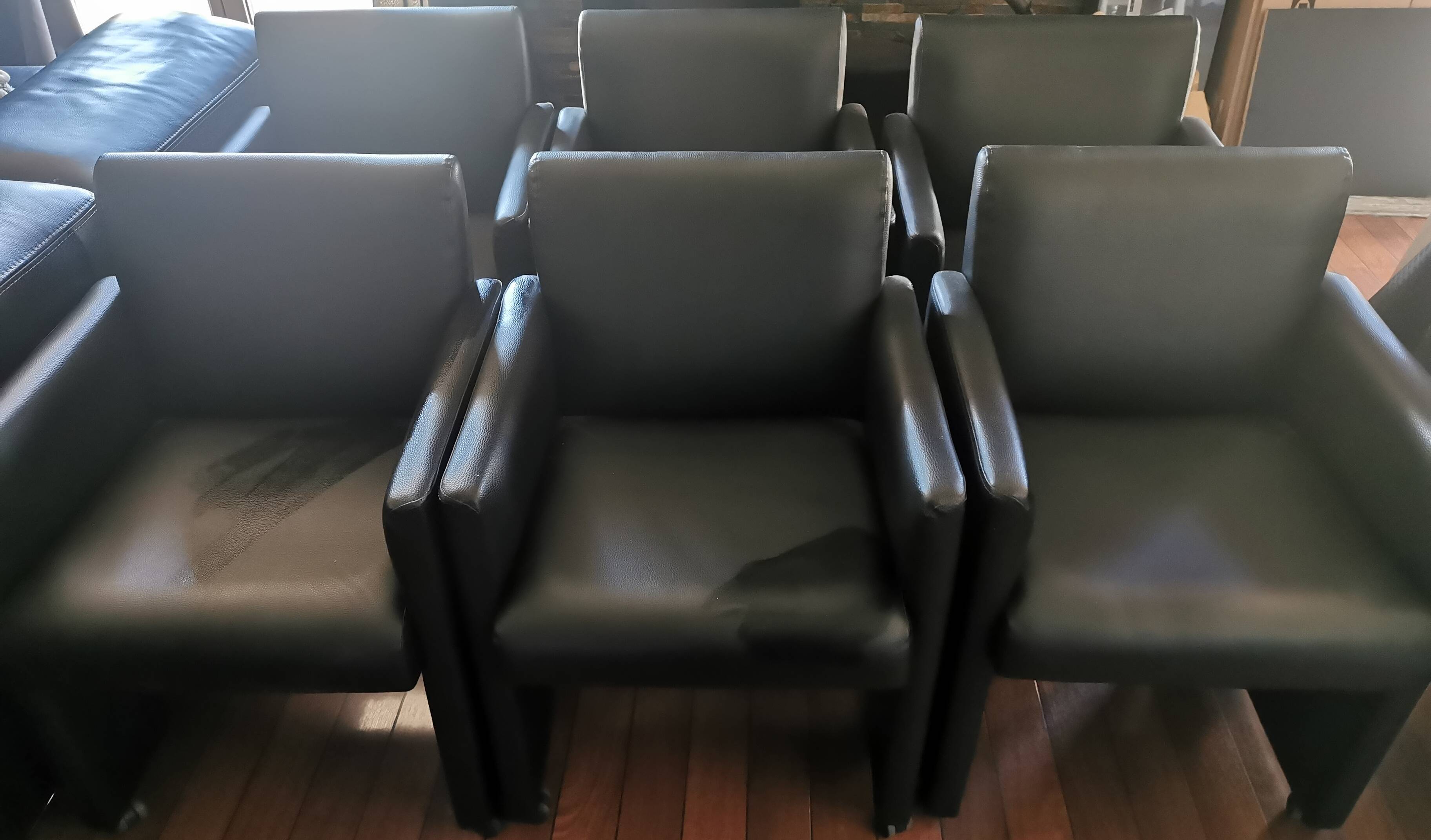 6 faux leather chairs on wheels