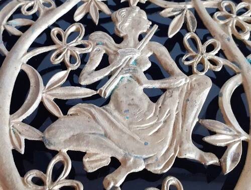 Old metal trivet