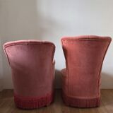 A pair of small tub chairs.