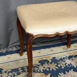Small Louis XV style bench with curved cabriole legs.