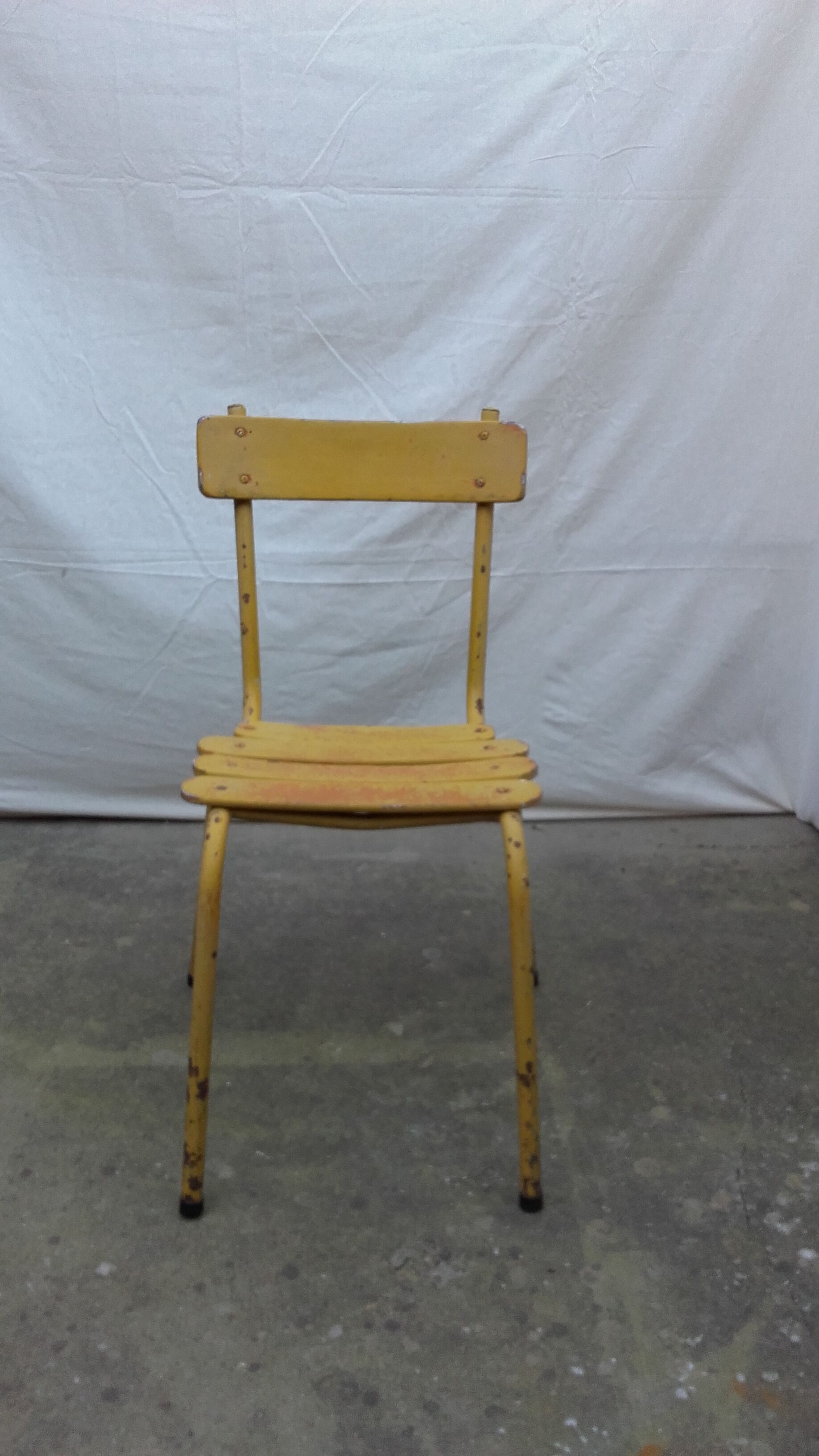 Three wooden and metal bistro chairs