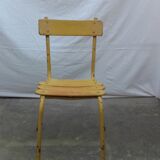 Three wooden and metal bistro chairs