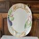 Very large serving dish with hares and vegetables.