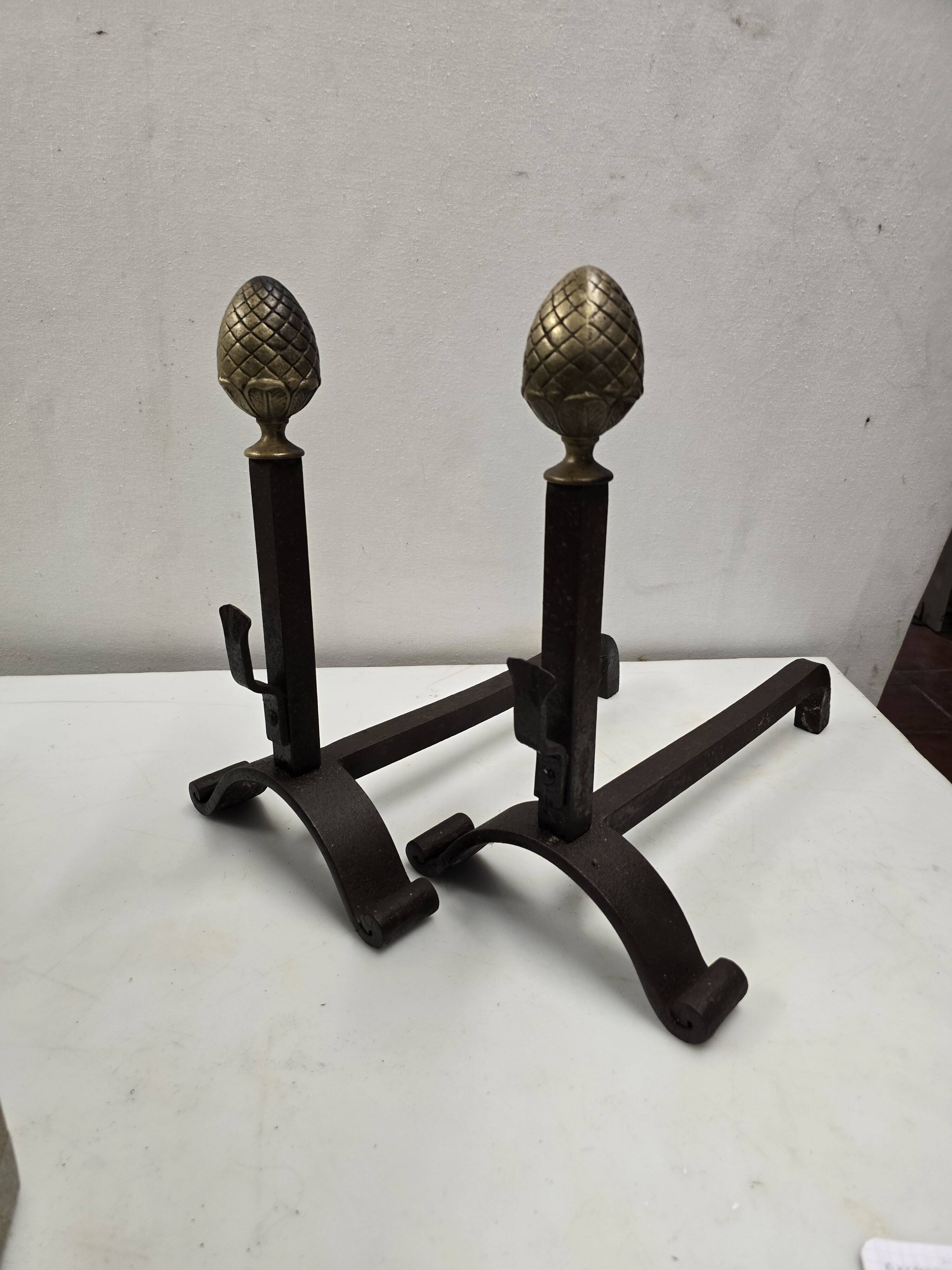 Old pair of wrought iron and bronze andirons