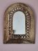 Small golden metal mirror in oriental style.
