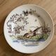 Polychrome ironstone dessert plates from Digoin and Sarreguemines.