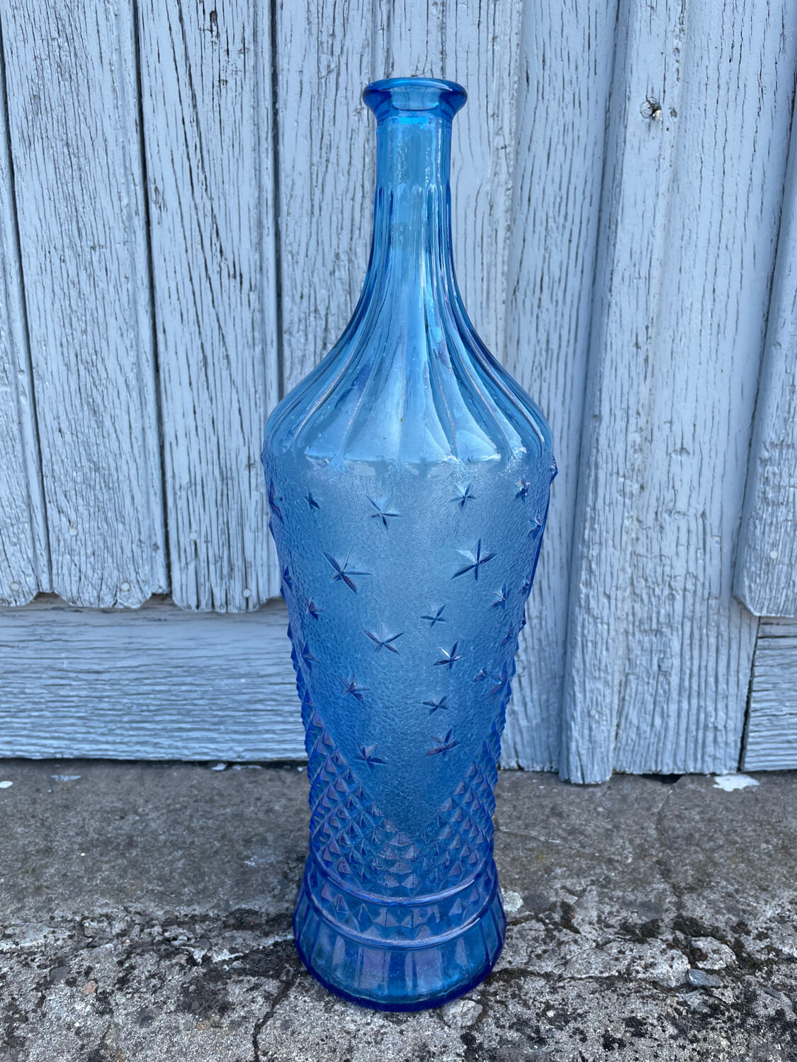 Blue glass decanter with a moon star motif