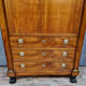 Secretary empire era with caryatid in blond mahogany around 1810