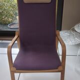 Relaxing armchair and its Scandinavian footrest
