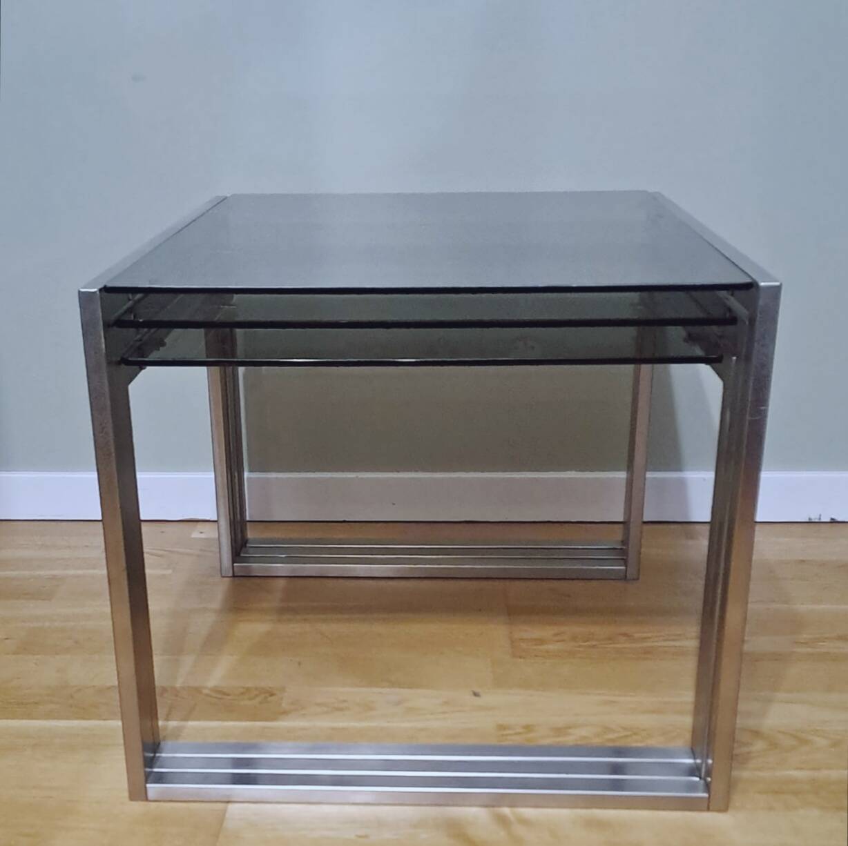 Chrome and smoked glass designer nesting table
