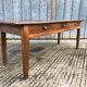 Antique chestnut farmhouse table with 3 drawers on the front.