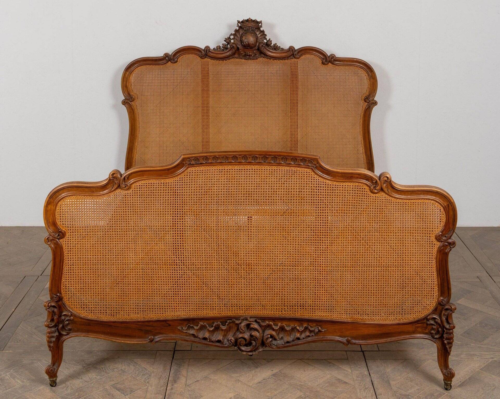 Louis XV style bed in carved and caned beech